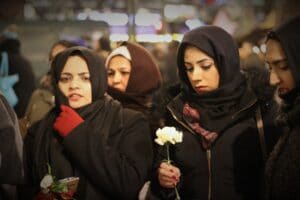 Muslim ladies on the street during winter time with flowers