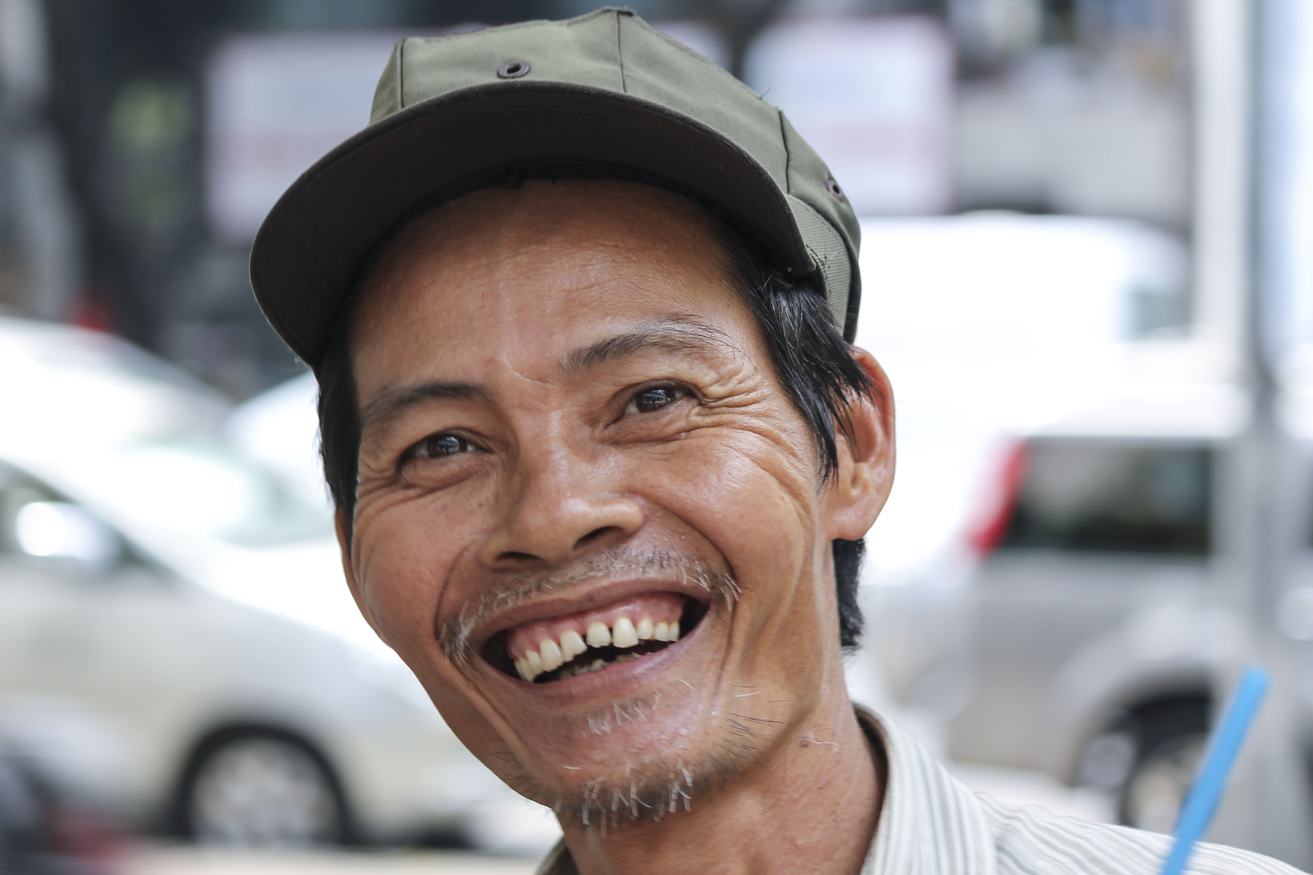 portrait of an asian man smiling